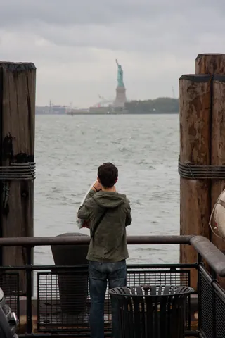 Tourist and Statue of Liberty, Battery Park