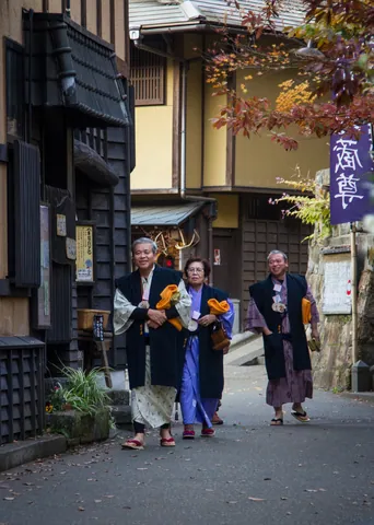 Japanese spa tourists in yukata robes, Kurokawa