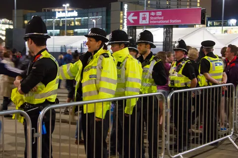Police watch the exit, Olympic Park