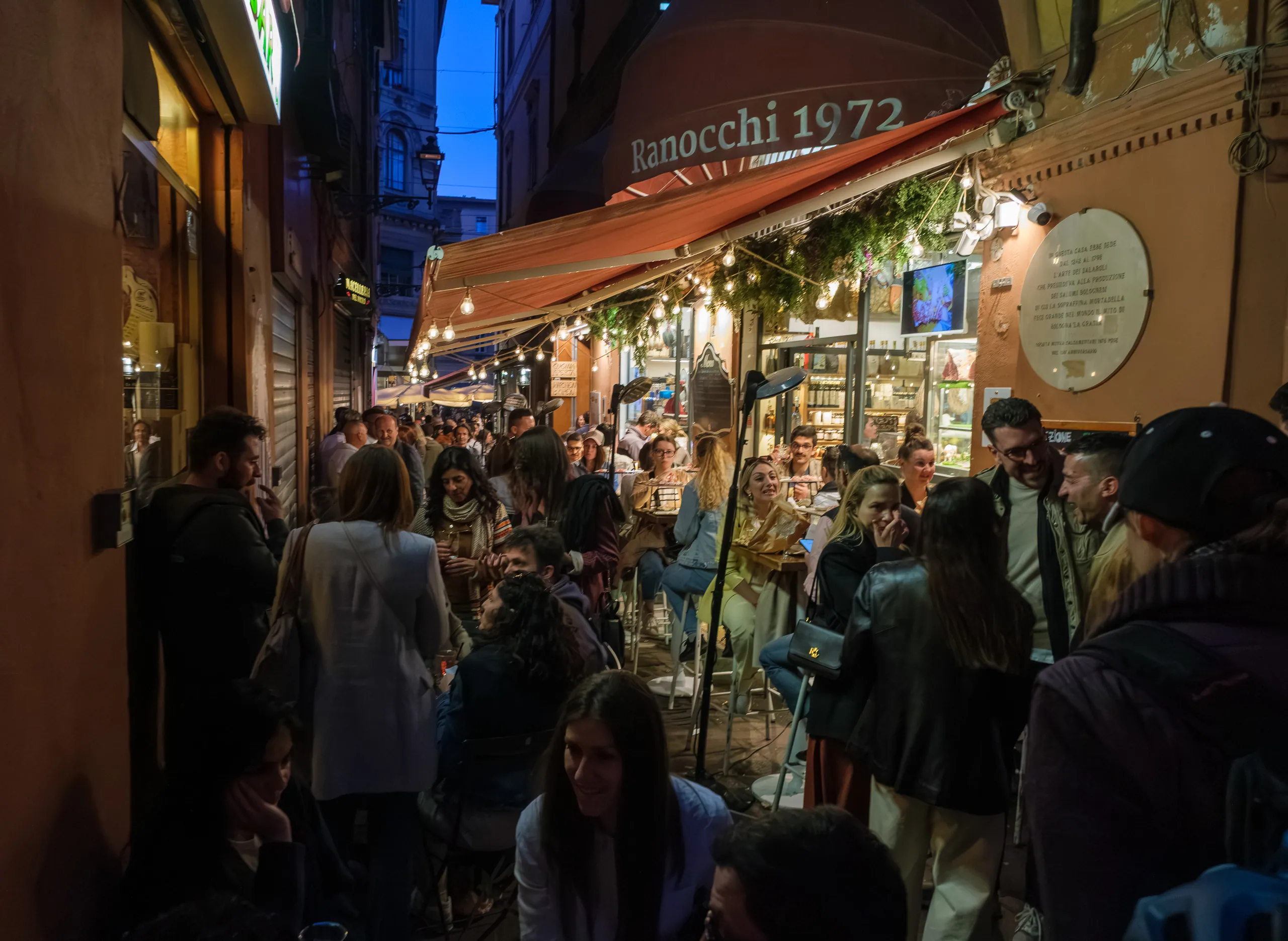 May Day crowds in the alleys of the Quadrilatero, Bologna