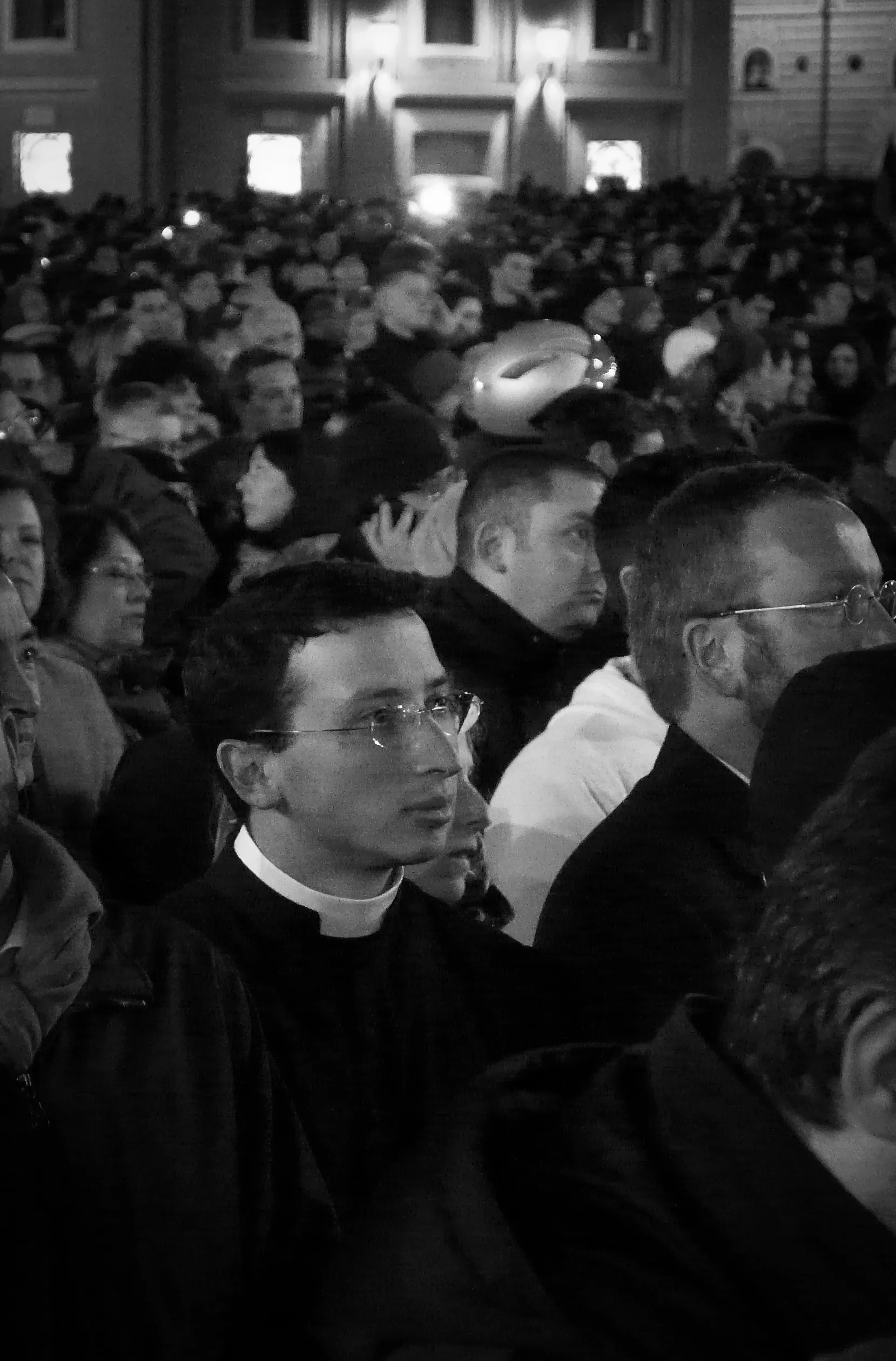 Catholic Priest listens to the first address of Pope Francis in Saint Peter's Square