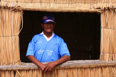 Tour guide in reed island, Lake Titicaca