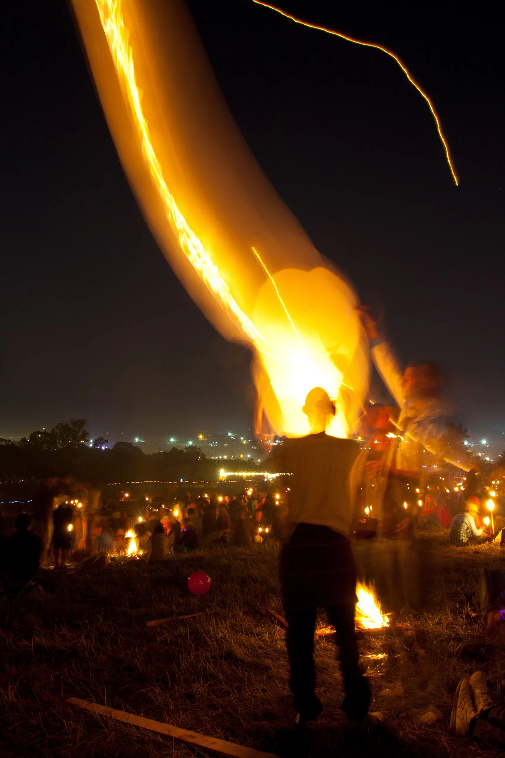 Man letting off fire lantern, Stone Circle