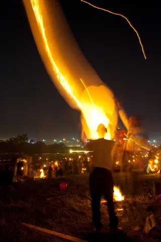 Man letting off fire lantern, Stone Circle