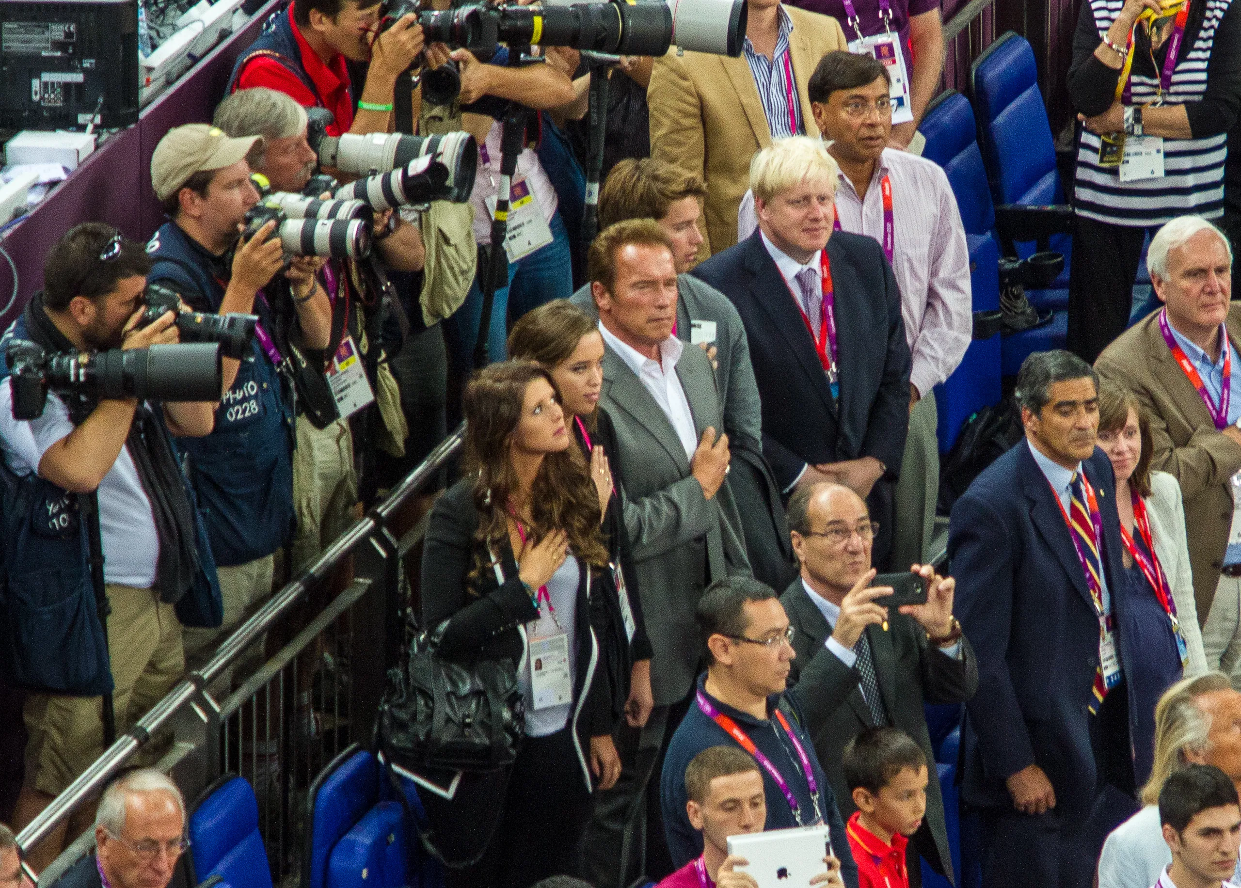 Arnold Schwarzenegger stands for the US national anthem while Boris Johnson looks on, USA Spain Olympic Basketball Final, August 12th 2012