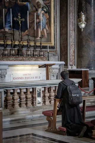 Prayer at the tomb of Pope John Paul II, St Peter's Basilica