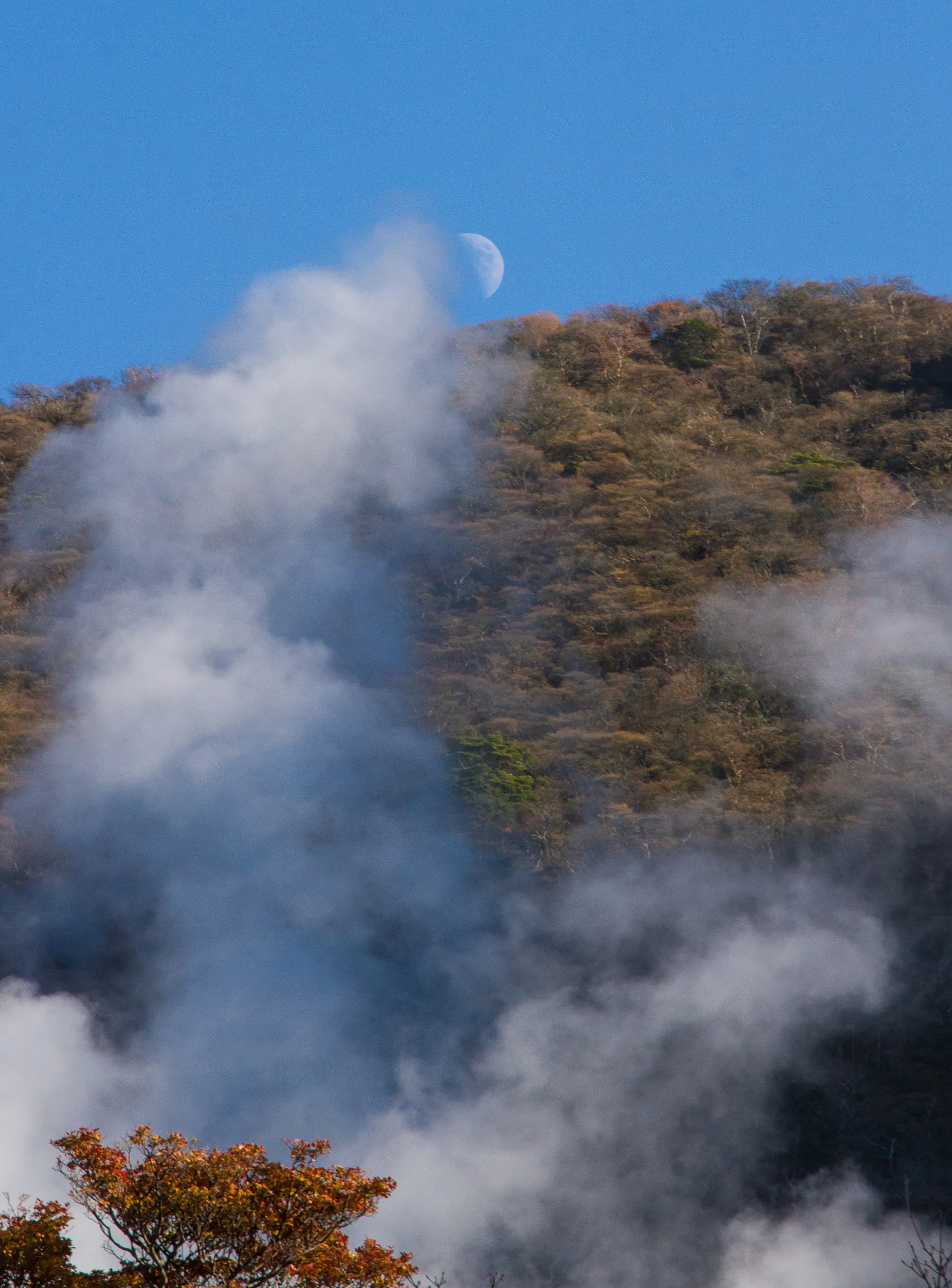 Steam vents of Owakaduni and rising moon