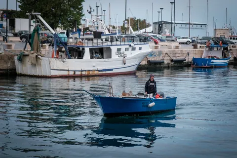 Fisherman in "Gozze" boat, Monopoli