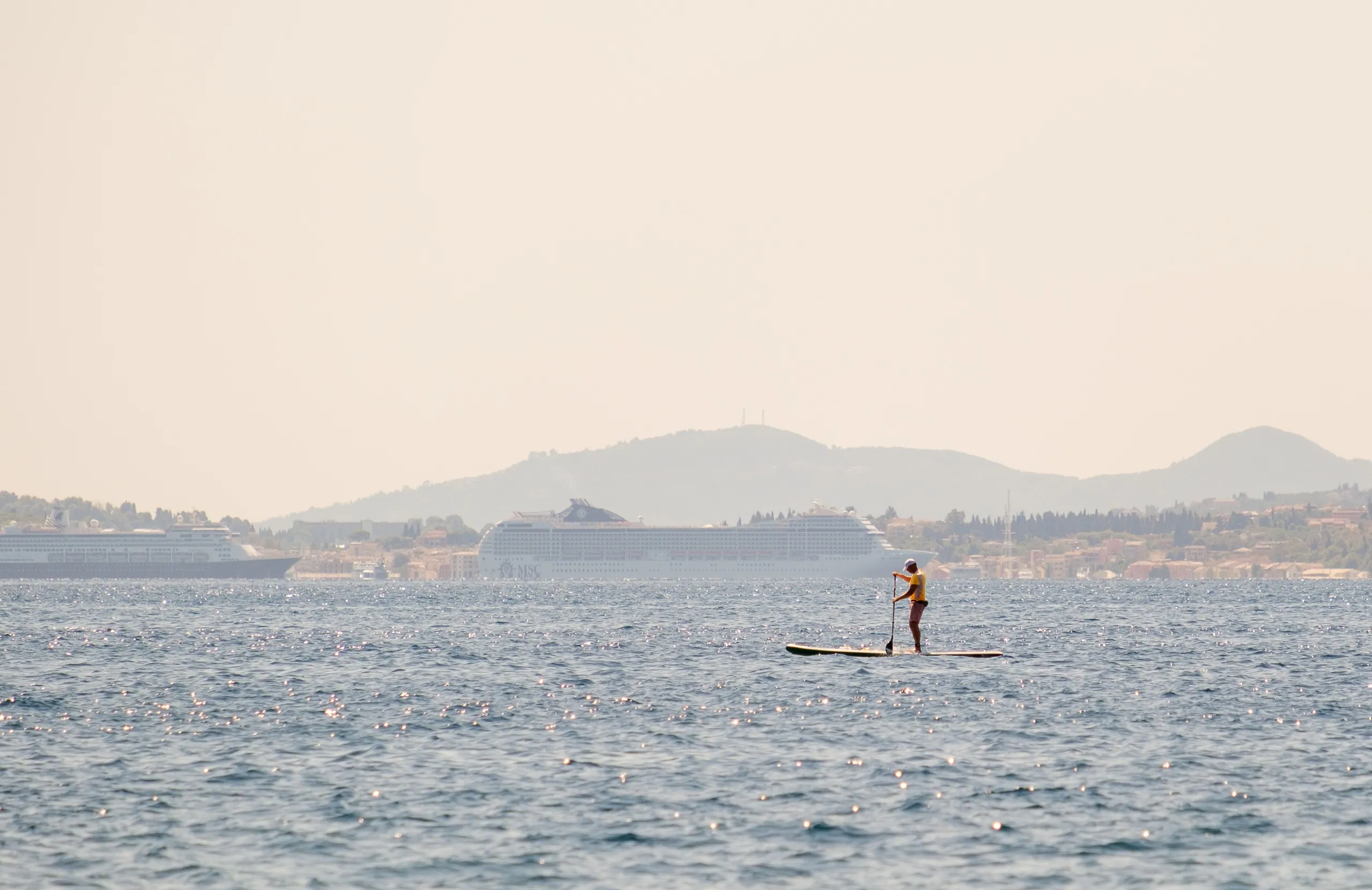 Paddle Boarder and Corfu Cruise Ships