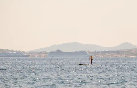 Paddle Boarder and Corfu Cruise Ships