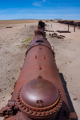 Standing atop an old train engine, Uyuni