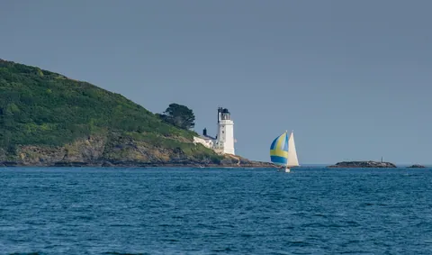 St Anthony Head Lighthouse and Sailboat