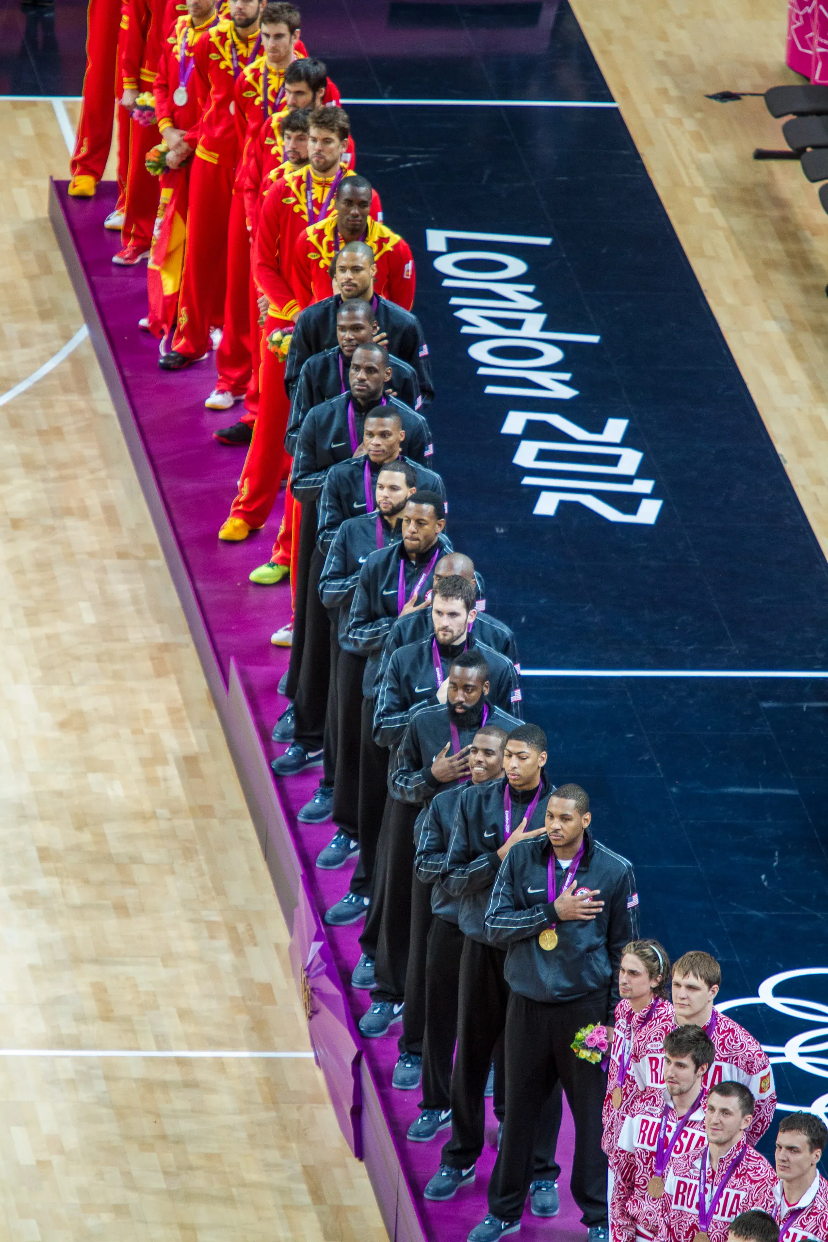 USA team, Olympic champions, stand for national anthem at medal ceremony, USA Spain Olympic Basketball Final, August 12th 2012