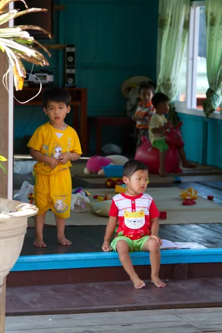 Schoolchildren in Vong Vieng floating fishing village, Ha Long Bay
