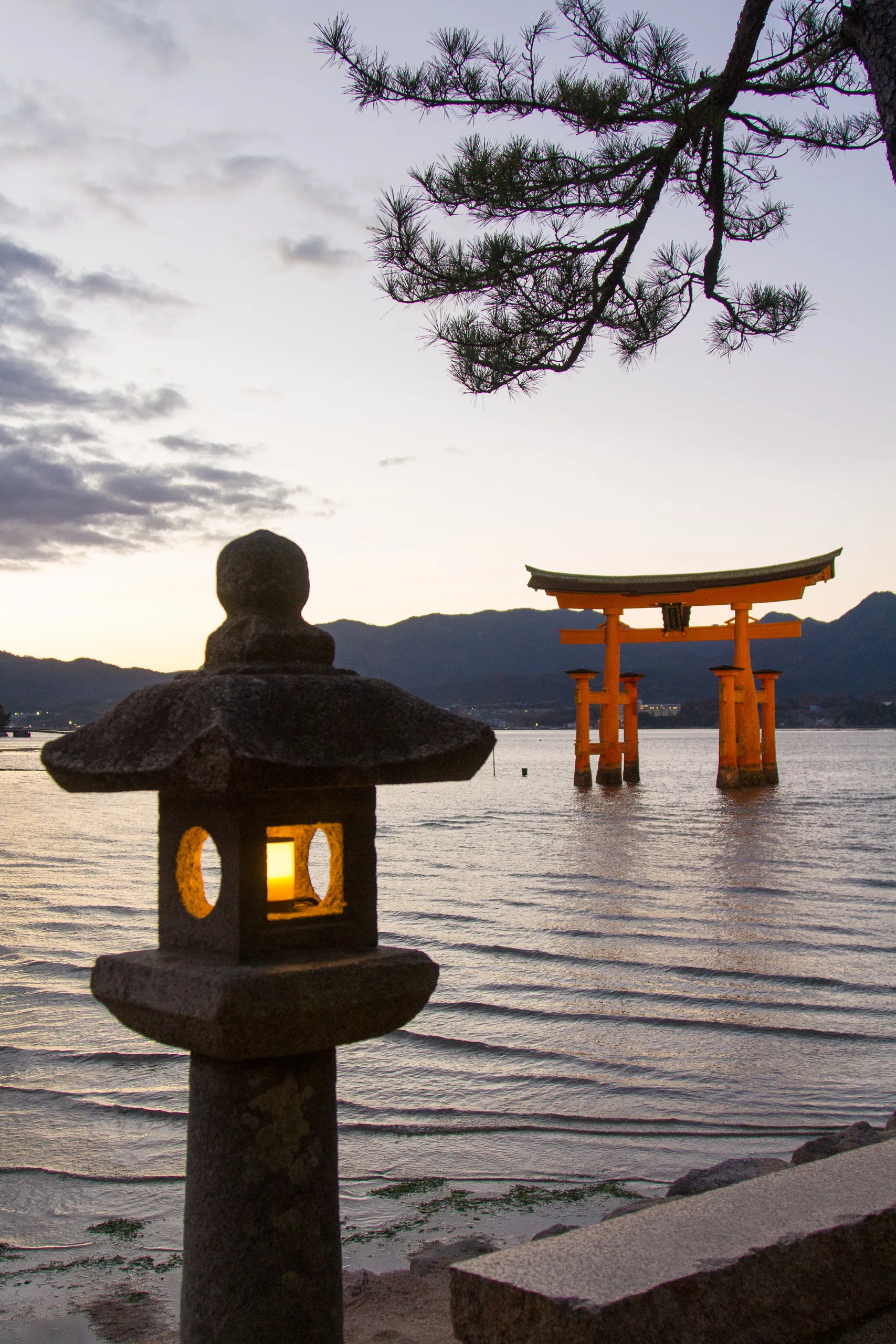 The famous Torii Gate of the Itsukushima Shrine with Lantern, Miyajima