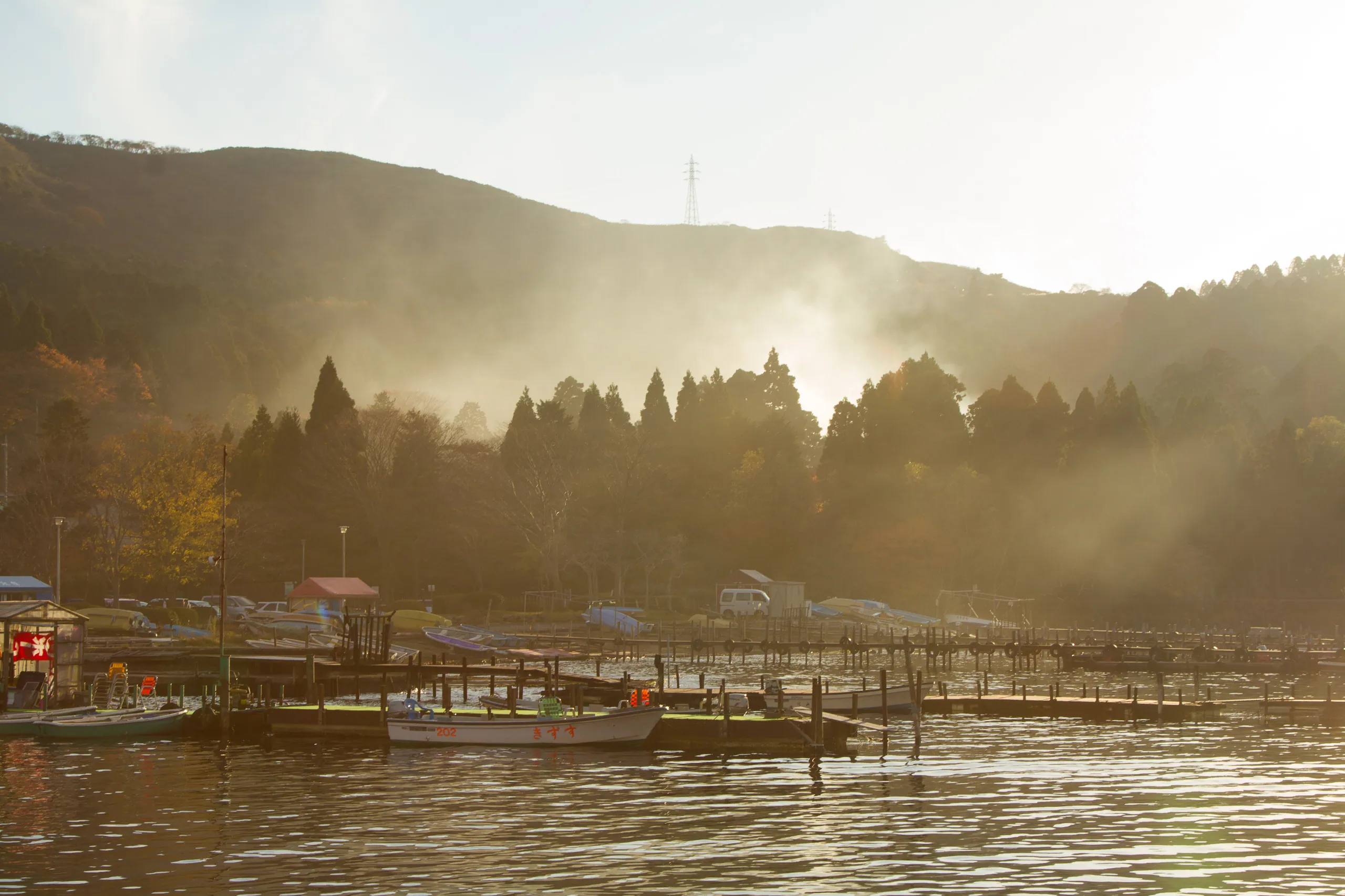 Geothermal steam and late afternoon sunshine on Lake Ashinoko