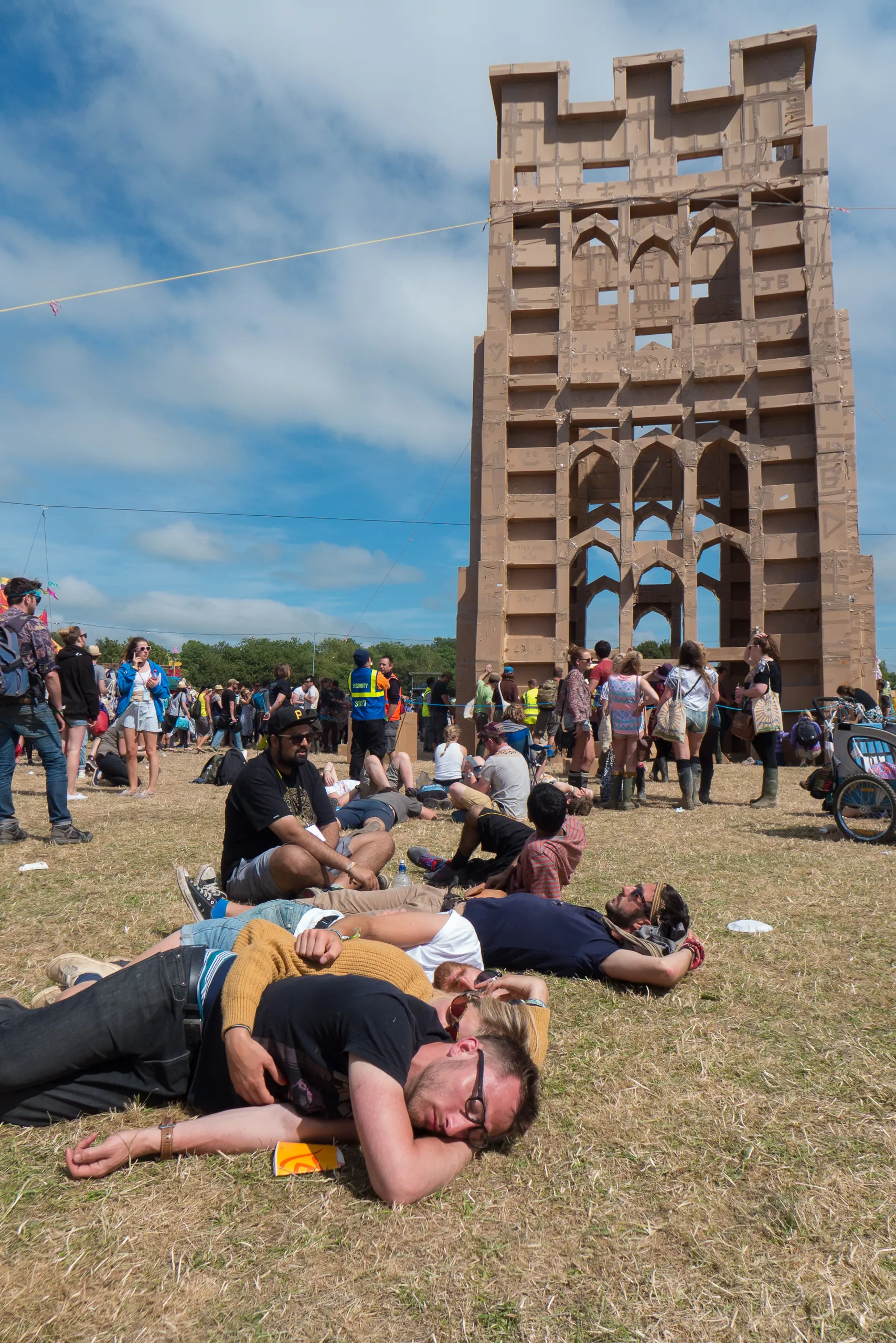 Sunday Snoozers in front of a cardboard 1:1 model of St Michael's Tower of Glastonbury Tor